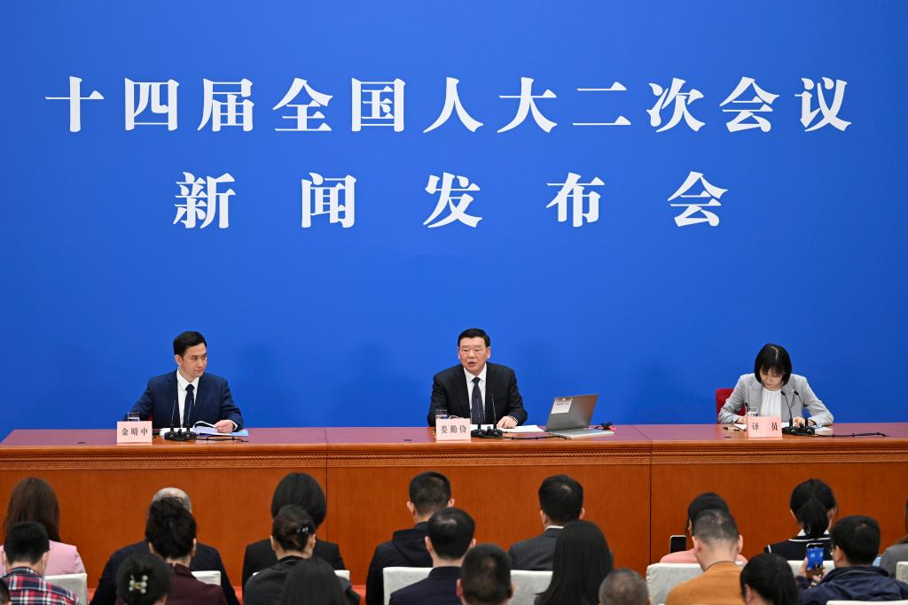 3月4日，十四屆全國人大二次會議在北京人民大會堂舉行新聞發(fā)布會。大會發(fā)言人婁勤儉就大會議程和人大工作相關(guān)問題回答中外記者的提問。 新華社記者 牟宇 攝